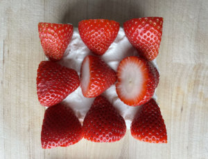 Bread with strawberries and whipped cream on top