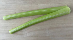 Peeled celery stalks before being chopped
