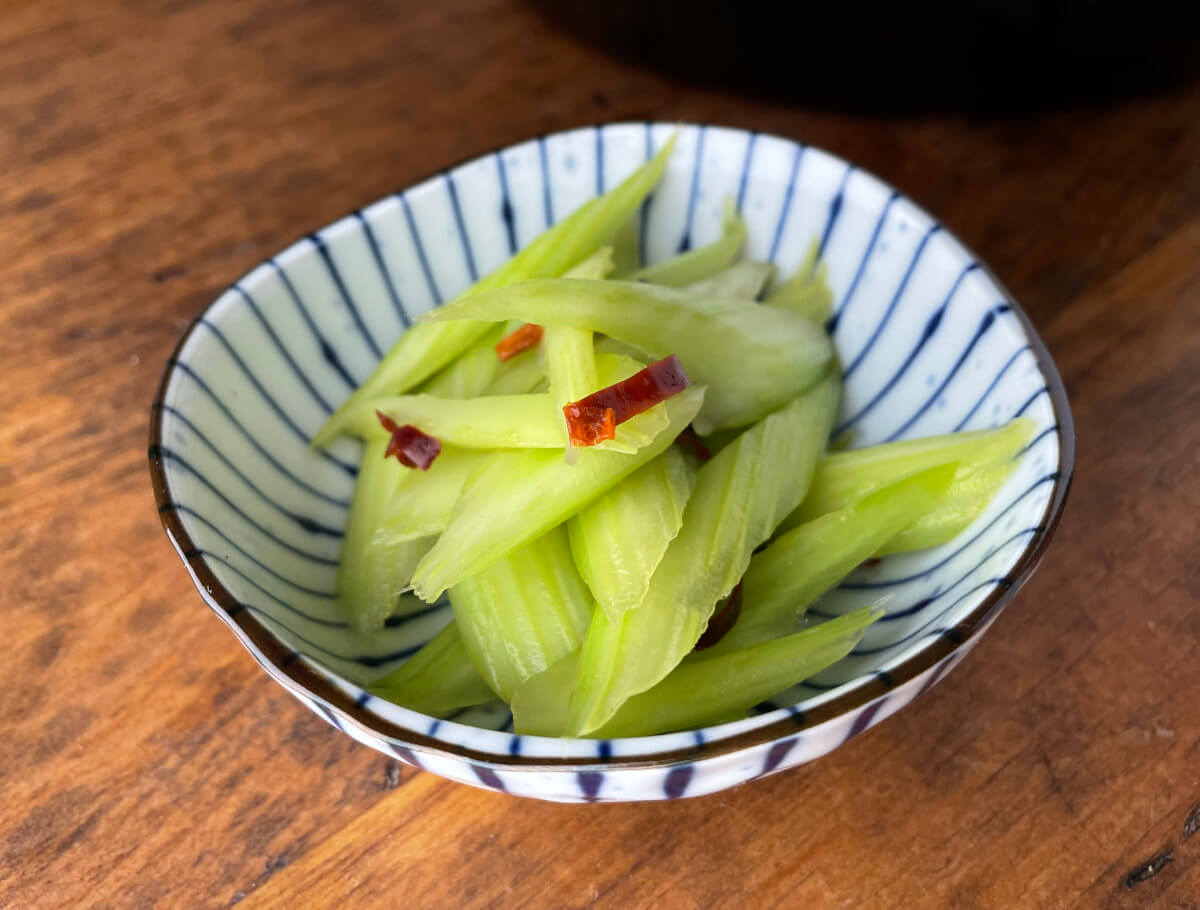 Japanese Pickled Celery Asazuke in a small striped bowl