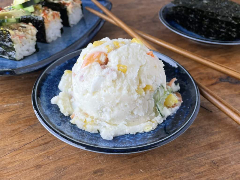 Japanese potato salad with sushi bake and seaweed in background