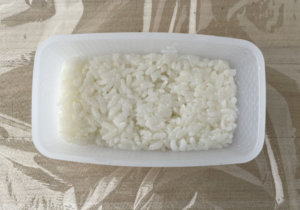 Rice pressed into spam musubi mold