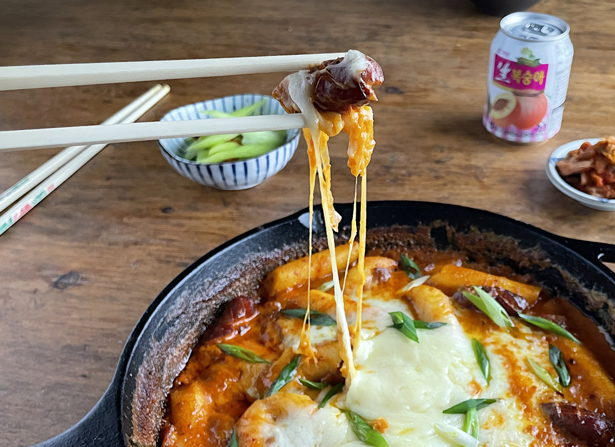 Sausage in chopsticks with cheese