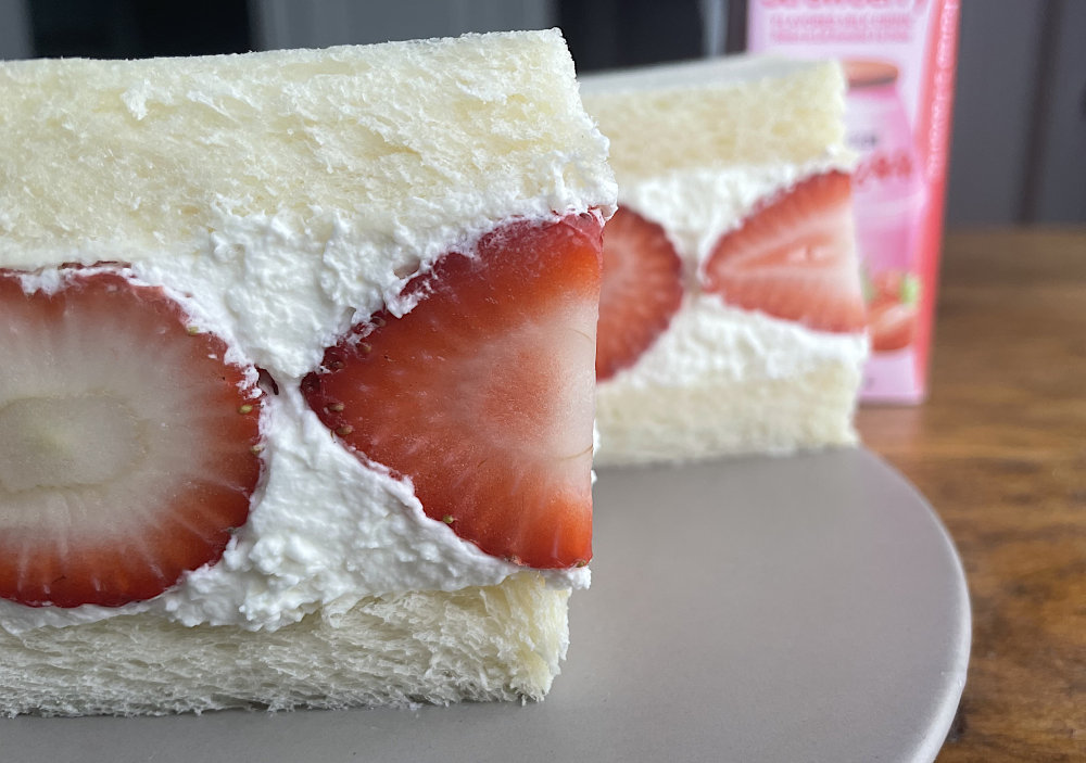 Strawberry sando with strawberry milk in background