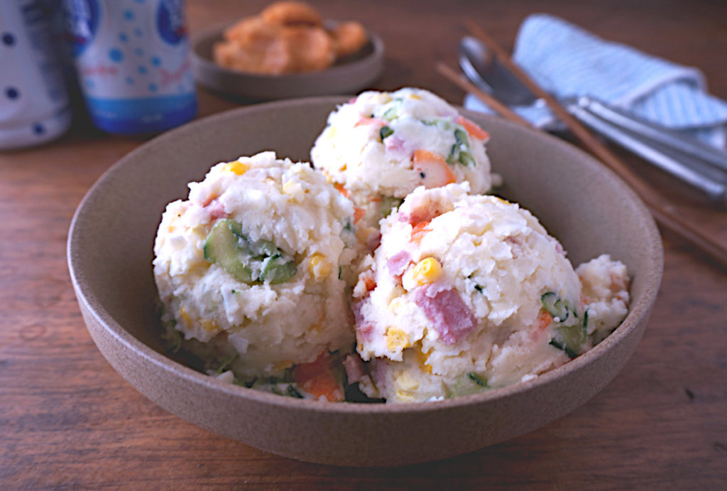 three scoops of japanese potato salad in a bowl sharpened