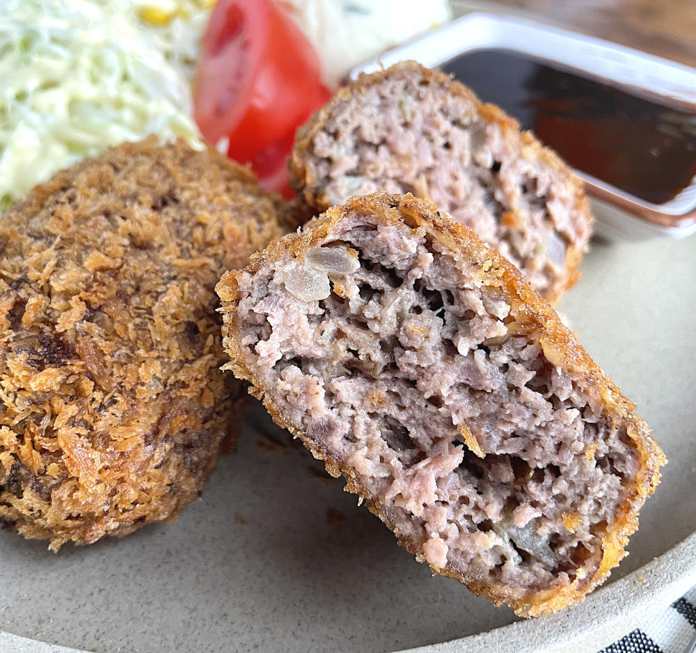 Close up of menchi katsu cut in half