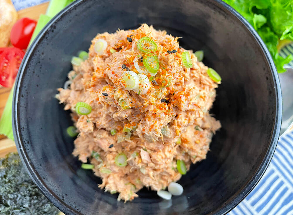 Close up of tuna salad in a black bowl