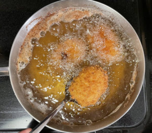Deep frying the menchi katsu