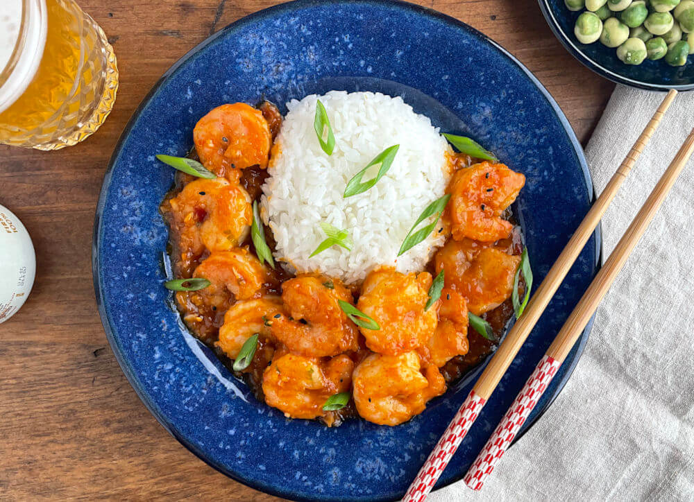 Ebi Chili Spicy Shrimp on a blue plate with white rice