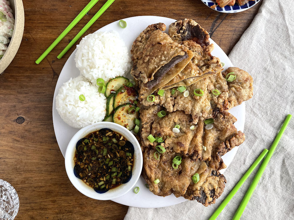 Meat jun with dipping sauce, rice, and cucumbers