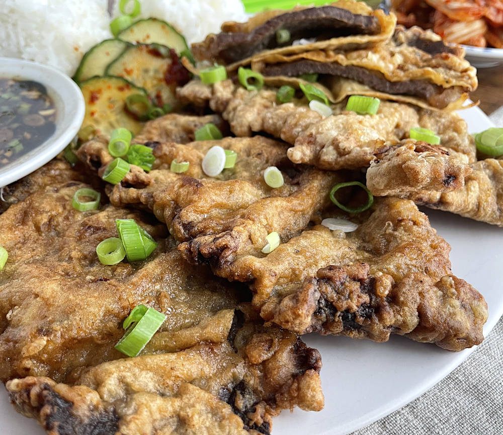 Meat jun with kimchi in background